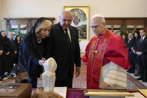 Nehmat Aoun, wife of President Joseph Aoun of Lebanon, shows Pope Leo XIV a bust of Lebanese St. Charbel during a meeting in the library of the Apostolic Palace at the Vatican June 13, 2025. (CNS photo/Vatican Media)