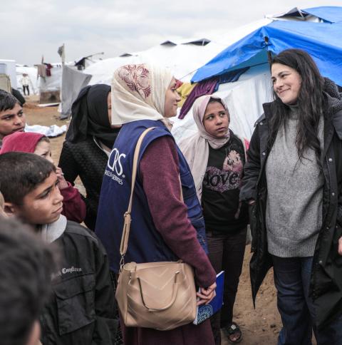 A Catholic Relief Services worker chats with people at a tent camp for displaced Palestinians in the Gaza Strip May 5, 2025. Jennifer Poidatz, acting representative for CRS in Jerusalem, the West Bank and Gaza, told OSV News July 31 that Gaza-based CRS staff are working to bring high-calorie, high-protein food to residents amid destroyed agricultural lands, fuel and energy deficits, high prices, danger and disease. (OSV News/CRS Staff)