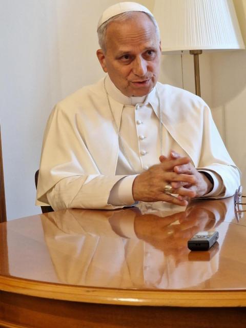 Pope Leo XIV answers a question from Elise Allen, senior correspondent at Crux, during an interview at the pope's residence inside the Vatican's Palazzo Sant'Uffizio July 30, 2025. (CNS photo/courtesy Crux)