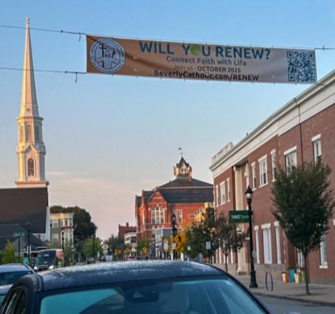 In September 2025, a Renew banner hangs over Main Street in Beverly, Massachusetts, where local Catholic parishes are in the process of forming small Christian communities. (Courtesy of Joe Nuzzi)