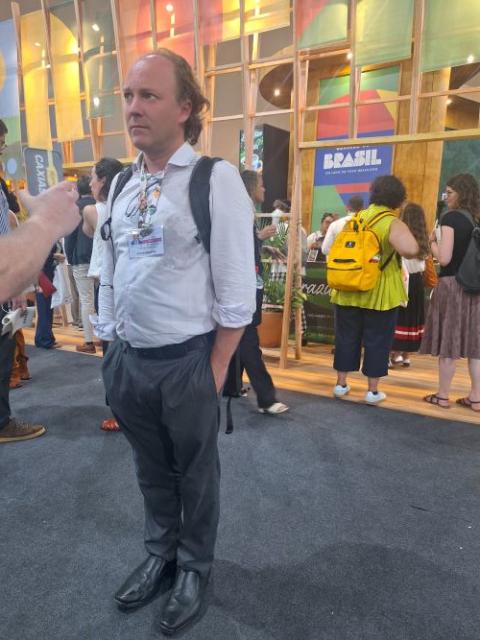 Rodrigo Agostinho, head of the Brazilian Institute of Environment and Renewable Natural Resources, speaks with reporters at COP30 in Belém, Brazil. 