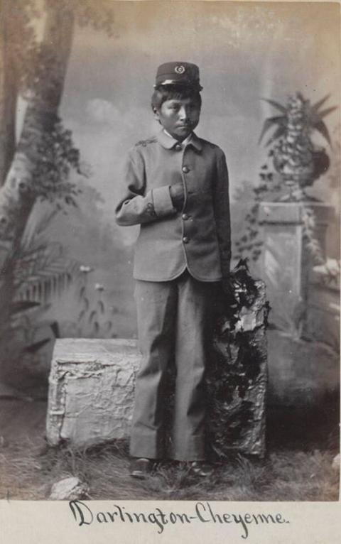 Native boy poses for portrait.