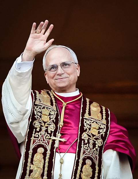 Pope Leo XIV, formerly Cardinal Robert F. Prevost, waves to the crowd in St. Peter’s Square from the central loggia of St. Peter's Basilica at the Vatican following his election as pope May 8, 2025. (CNS/Lola Gomez)