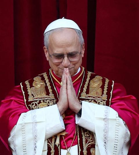 Pope Leo XIV pauses on the central balcony of St. Peter's Basilica at the Vatican May 8, 2025, following his election during the conclave. (OSV News/Reuters/Guglielmo Mangiapane)