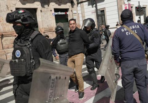 Riot police detain a man during a demonstration in Morelia, Mexico, Nov. 2, 2025, over the assassination of Uruapan Mayor Carlos Manzo. Manzo was assassinated Nov. 1 in a plaza in front of dozens of people who had gathered for Day of the Dead festivities, authorities said. (OSV News/Reuters/Ivan Arias)