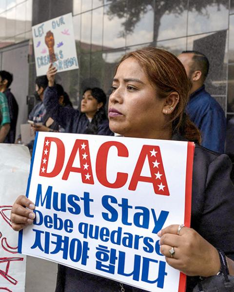 Beatrice Cruz of Arizona holds a sign in support of the Deferred Action for Childhood Arrivals policy after a hearing on the DACA program, outside the federal courthouse in Houston June 1, 2023. (OSV News/Reuters/Adrees Latif)