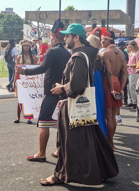 Br. João Paulo Gabriel, a Brazilian Franciscan friar, walks in the climate march Nov. 15 in Belém, Brazil. (Eduardo Campos Lima)