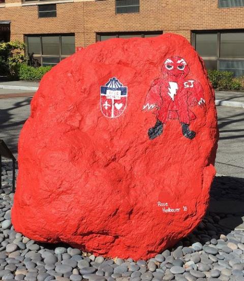 A drawing on a rock at St. Johns University depicts Johnny Thunderbird, the school's mascot. 