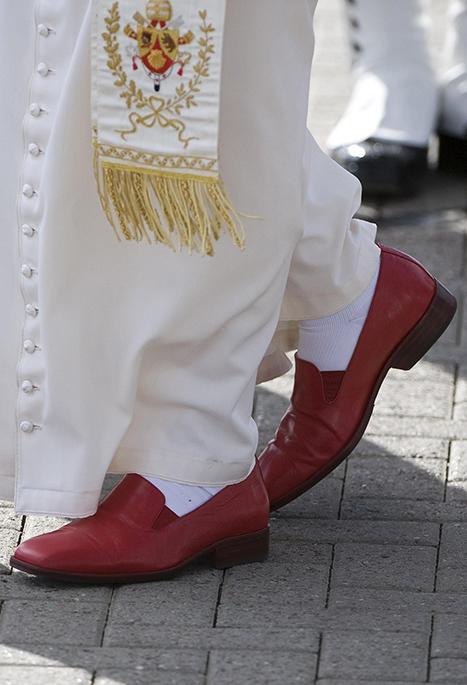 Pope Benedict XVI's red shoes are seen in 2010 as he arrives at Edinburgh Airport in Scotland. (CNS/Reuters/Derek Blair)