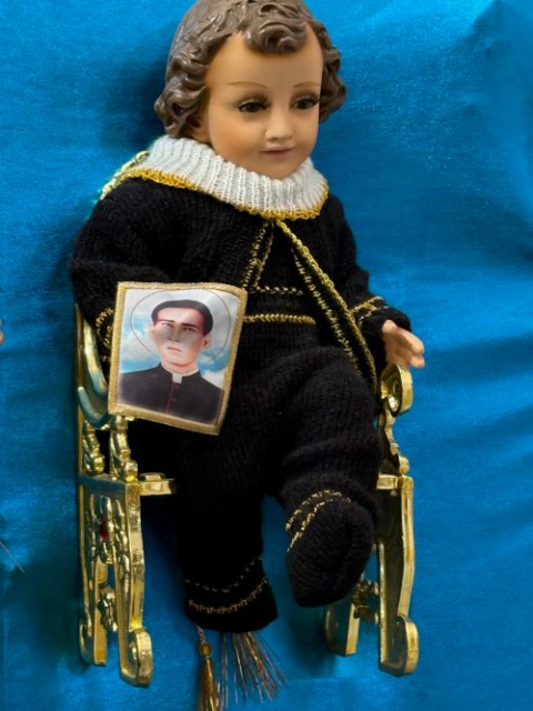  A Baby Jesus figurine dressed as the patron of Mexican migrants, St. Toribio Romo, is displayed Jan. 27 at a Mexico City market dedicated to the preparation of plaster representations of the Christ Child for presentation at church Feb. 2, Candlemas Day. (Anita Snow)