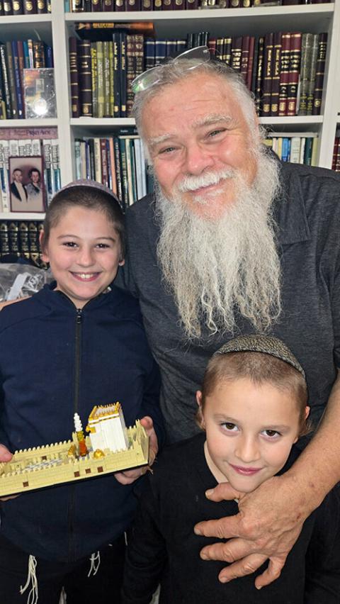 Paul "Shlomo" Helinski of Geulah Products, with sons Shalom, left, and Yehuda (RNS/Courtesy of Paul Helinski)