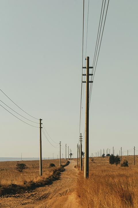 A dirt road is seen in Emalahleni, South Africa. (Unsplash/Auston Mtabane)
