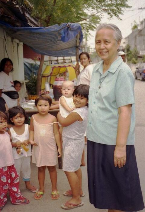 Sr. Christine Tan stands in Leveriza, Manila, Philippines. She and four other Good Shepherd Sisters chose to live among the urban poor. (Courtesy of RGS Philippines-Japan Secretariat Office)