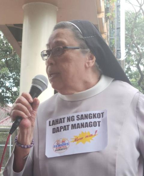 Sr. Mary John Mananzan speaks at a 2025 protest on the 40th anniversary of the EDSA Peoples' Revolution that ousted the Marcos dictatorship. (Courtesy of Mary John Mananzan)
