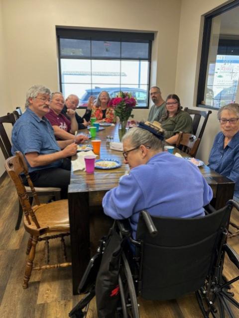 Guests enjoying their Easter dinner at the community's new dining table at the Stepping Stone Medical Respite. (Courtesy of Sr. Idelle Badt)