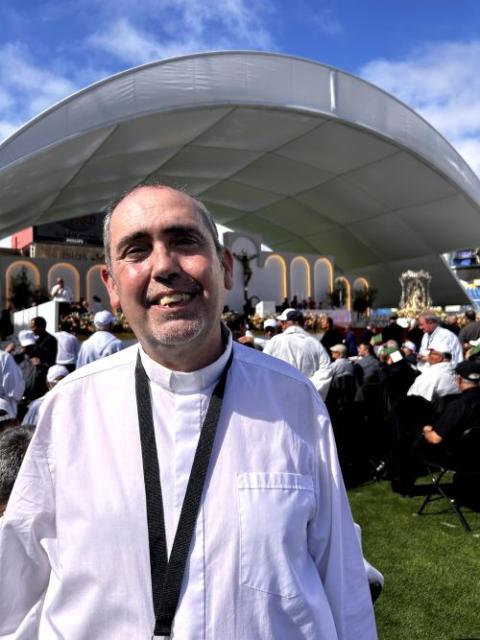 Fr. Víctor Domínguez González, the diocesan delegate for migration of the Canarias Diocese, poses for a photo at papal Mass in the Stadium of Gran Canaria in Las Palmas de Gran Canaria, Spain, June 11, 2026. (NCR photo/Justin McLellan