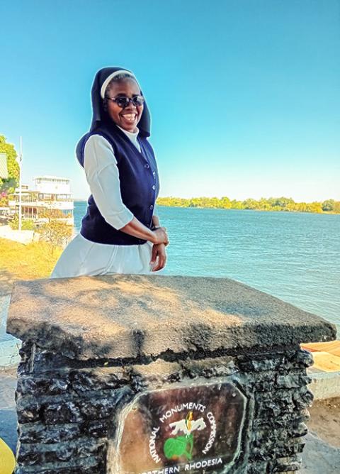 Sr. Perpetua Namasiku Mutonga enjoys a light moment at the Zambezi River in Livingstone, Zambia's tourist capital. (Derrick Silimina)
