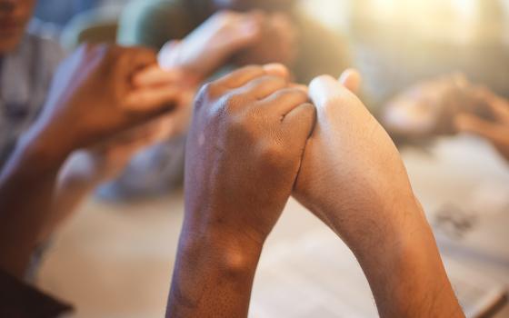 "The table is where it all begins, with an invitation to belong, to be seen and to be nourished. It is a powerful metaphor for the kingdom of God, a place of grace, nourishment and reconciliation." (Dreamstime/Yuri Arcurs)