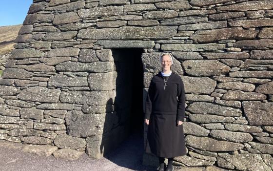 Sr. Kathryn Press stands in front of the Gallarus Oratory in Dingle Peninsula, Co. Kerry, Ireland, in March. 