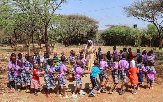 Sr. Felister Maria Kwamboka, who belongs to the Franciscan Sisters of St. Joseph Asumbi, plays with children at the nursery school that is part of the Baragoi Catholic Mission in Samburu County, northern Kenya. The school provides a safe space for children from all the tribes in Baragoi to learn and play. (Lourine Oluoch)