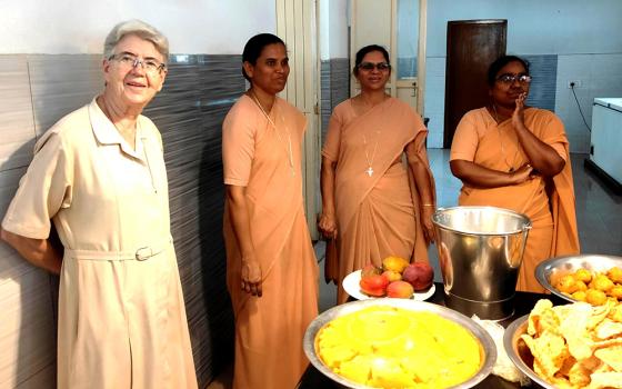 Franciscan Sisters of the Immaculate Sr. Maria Rosa (far left) is pictured with her Indian colleagues (left to right) Srs. Sagaya Rani, Marneni Jayamma and Sindhuja before serving lunch to the residents of Sumanahalli in Bengaluru, southern India. (Thomas Scaria)