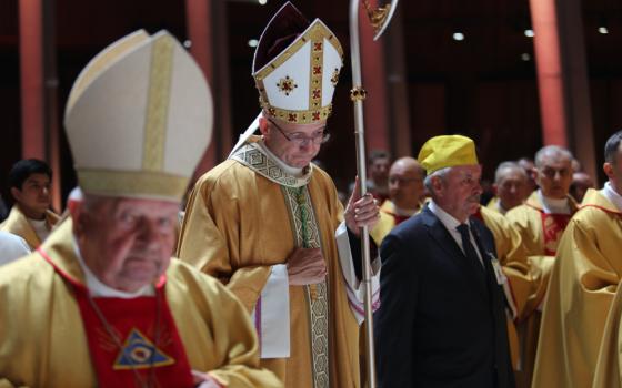 Archbishop Adrian Galbas of Warsaw, Poland, prays during Mass March 13, 2025, in Warsaw's Temple of Divine Providence. Archbishop Galbas in a July 25 statement said that he was "devastated and crushed" by the arrest of a diocesan priest in the brutal murder of a homeless man July 24 and the priest's confession to police he did it. (OSV News/courtesy Polish bishops' conference)