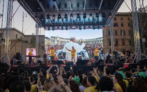 A band performs in front of an image of Pope Leo XIV displayed on a large screen during a festival in Risorgimento Square in Rome July 29, 2025, as part of the Jubilee of Digital Missionaries and Catholic Influencers. (CNS/Pablo Esparza)