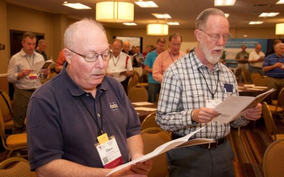 In this 2012 photo, Frs. Dave Holloway of the Diocese of Kansas City-St. Joseph, Missouri, and Ted Olson of the Diocese of Orange, California, participate in morning prayers April 25 on the third day of the annual National Federation of Priests' Councils convention in Nashville, Tennessee. (CNS/Tennessee Register/Theresa Laurence)