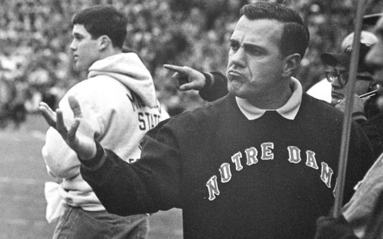 Notre Dame coach Ara Parseghian gestures during a college football game against Michigan State, in East Lansing, Mich. Nov. 19, 1966. Parseghian, who took over a foundering Notre Dame football program and restored it to glory with two national championships in 11 seasons, is the namesake of a rare diseases research program at Notre Dame. (AP/file)