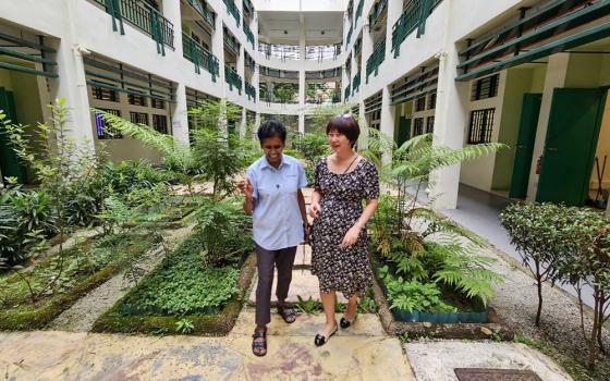 Good Shepherd Sr. Jean Fernandez, left, takes a walk with a friend to enjoy a bit of nature. (Courtesy of Jean Fernandez)