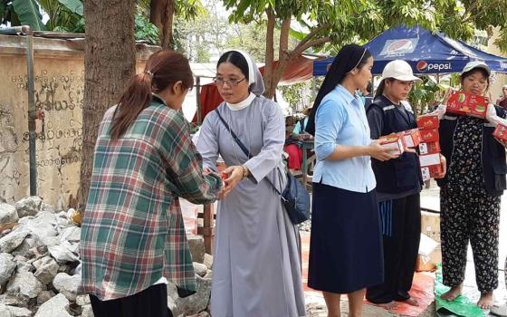 Catholic nuns distribute relief materials to the victims of a 7.7 magnitude earthquake in Mandalay, Myanmar. (Courtesy of Melanie Mai Chit Yin)