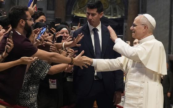 Pope Leo XIV greets faithful at the end of a mass celebrated by Cardinal Luis Antonio Tagle in St. Peter's Basilica on the occasion of the Youth Jubilee at the Vatican, July 29, 2025. (AP Photo/Gregorio Borgia)