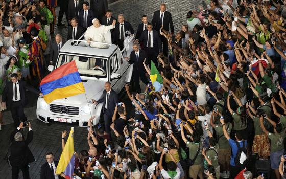 Pope Leo XIV greets faithful in St. Peter's Square at the end of a welcome mass for the Youth Jubilee at the Vatican July 29, 2025. (AP Photo/Gregorio Borgia)