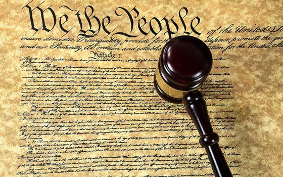 A gavel on top of a copy of the Constitution of the United States (Dreamstime/Maria Dryfhout)