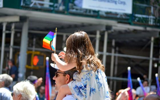 A child waves a pride flag at the New York City Pride Parade in Manhattan June 29, 2025. (Dreamstime/Cpenler)