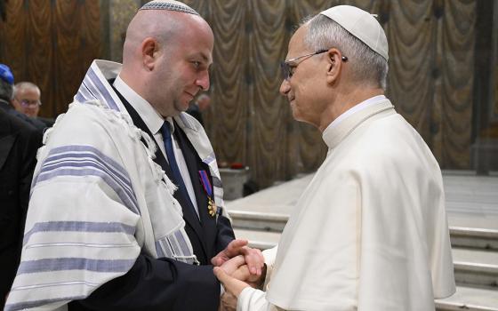 Pope Leo XIV greets Silviu Vexler, president of the Federation of Jewish Communities in Romania, during a ceremony honoring Blessed Iuliu Hossu in the Sistine Chapel at the Vatican June 2, 2025. (CNS photo/Vatican Media)