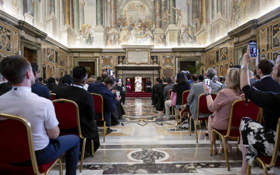 Participants take photos of Pope Leo XIV during his audience with people attending a conference on the ecumenical implications of the 1,700th anniversary of the Council of Nicaea June 7, 2025, in the Clementine Hall of the Apostolic Palace at the Vatican. (CNS/Vatican Media)