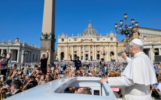Pope Leo XIV gives a thumbs-up as he rides the popemobile around St. Peter's Square at the Vatican before his weekly general audience Aug. 6, 2025. (CNS/Vatican Media)