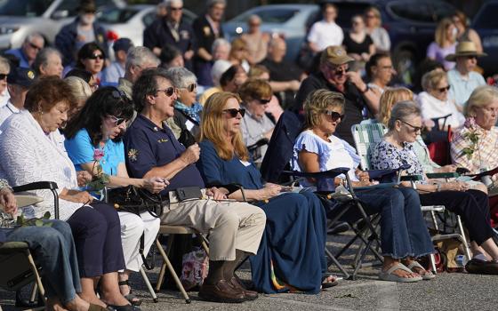 Parishioners and members of other area parishes participate in a "Keep Our Priests" rosary rally at St. Mary Church in East Islip, New York, April 29, 2024. More than 300 people gathered to pray for changes in U.S. immigration procedures to prioritize visa and green card applications for foreign-born religious workers, many of whom are being forced to leave the country because of federal delays in processing immigration paperwork. (OSV News/Gregory A. Shemitz)