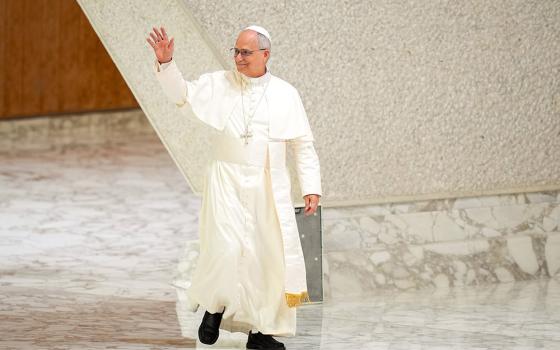 Pope Leo XIV greets visitors and pilgrims as he arrives in the Paul VI Audience Hall at the Vatican for his weekly general audience Aug. 20, 2025. (CNS/Lola Gomez)