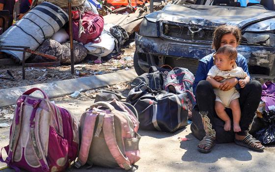 Displaced Palestinian children sit near their belongings during an Israeli military operation in Gaza City, Aug. 26, 2025. (OSV News/Reuters/Ebrahim Hajjaj)