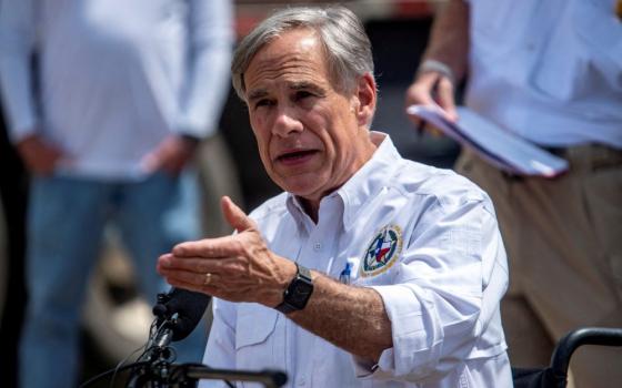 Greg Abbott speaks to press. 