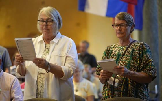 Liz Mach, left, and Mary Orth-Lauer, members of the Maryknoll Lay Missioners' class of 1976, renew their commitment to living a life of mission during a Mass Aug. 16 at the Maryknoll Society Center in Maryknoll, N.Y., marking the 50th anniversary of the founding of the Maryknoll Lay Missioners. Mach and Orth-Lauer both served in Tanzania. (OSV News/Gregory Shemitz)