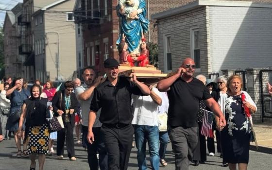 Members of the Newark Italian Apostolate carry the statue of la Madonna della Fontana in Newark. The organization has helped to grow several saint feasts in Northern New Jersey and organize other events as well(Italian Apostolate of the Newark Archdiocese)