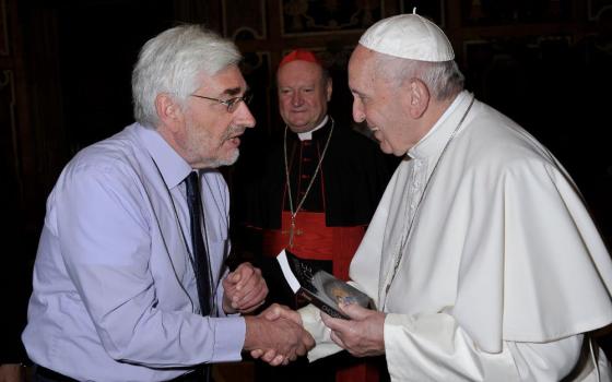 Ken Butigan meets Pope Francis during a September 2019 conference at the Vatican called "The Common Good in the Digital Age." (Courtesy of Ken Butigan)