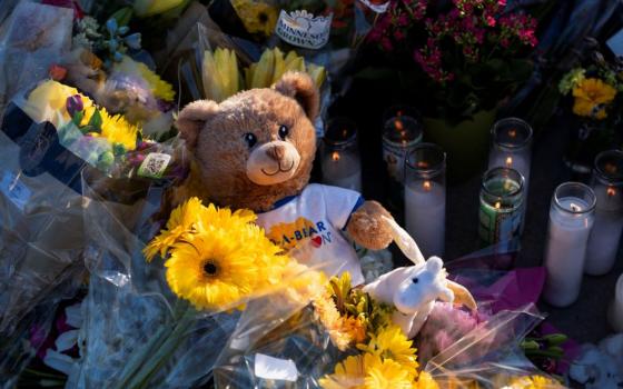 A teddy bear lies at a makeshift memorial at Annunciation Church in Minneapolis Aug. 28,  following a fatal shooting the previous day. (OSV News/Reuters/Tim Evans)
