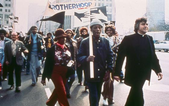 Fr. William Cunningham leads an annual Walk for Focus: HOPE in Detroit in the early 1980s. (Courtesy of Focus: HOPE)