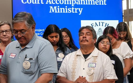 Court accompaniment volunteers gather for a blessing at the Pastoral Center of the San Diego Diocese, at the launch of "FAITH" — "Faithful Accompaniment In Trust & Hope" — a program to make sure refugees and asylum seekers are not alone at immigration hearings. (Chris Stone)
