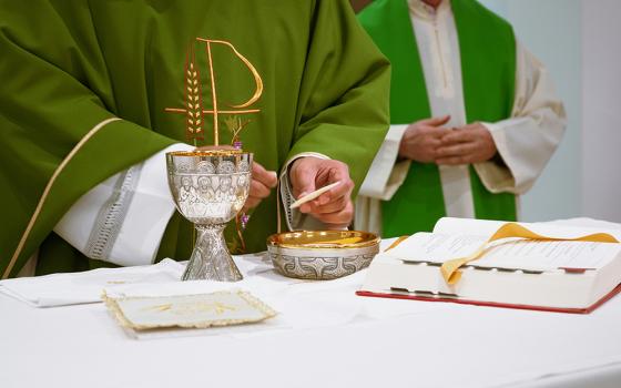 A priest celebrates the Liturgy of the Eucharist. (Unsplash/Lennon Caranzo)