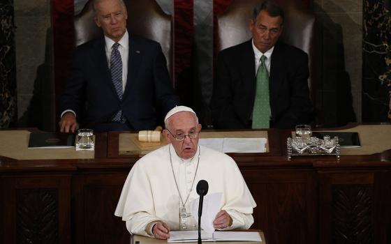 Pope Francis addresses a joint meeting of the U.S. Congress as then-Vice President Joe Biden (left) and then-Speaker of the House John Boehner look on in the House of Representatives Chamber at the U.S. Capitol in Washington Sept. 24, 2015. (CNS/Paul Haring)